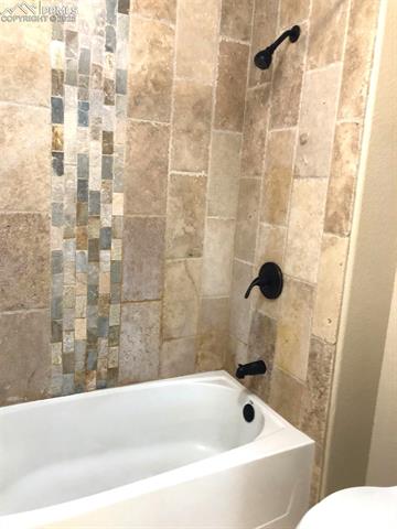 3575 Indigo Ridge Point Colorado Springs, CO 80910 - Photo 18 of 27 Primary Bath with contemporary tile accents
