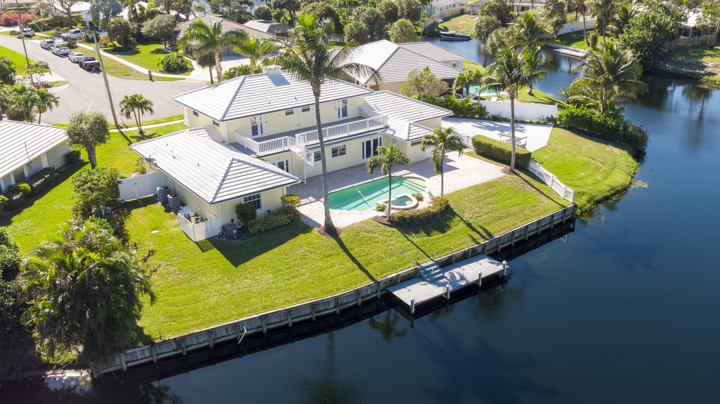 12920 Barrow Road North Palm Beach, FL 33408 - Photo 1 of 32 an aerial view of a pool patio swimming pool and outdoor seating