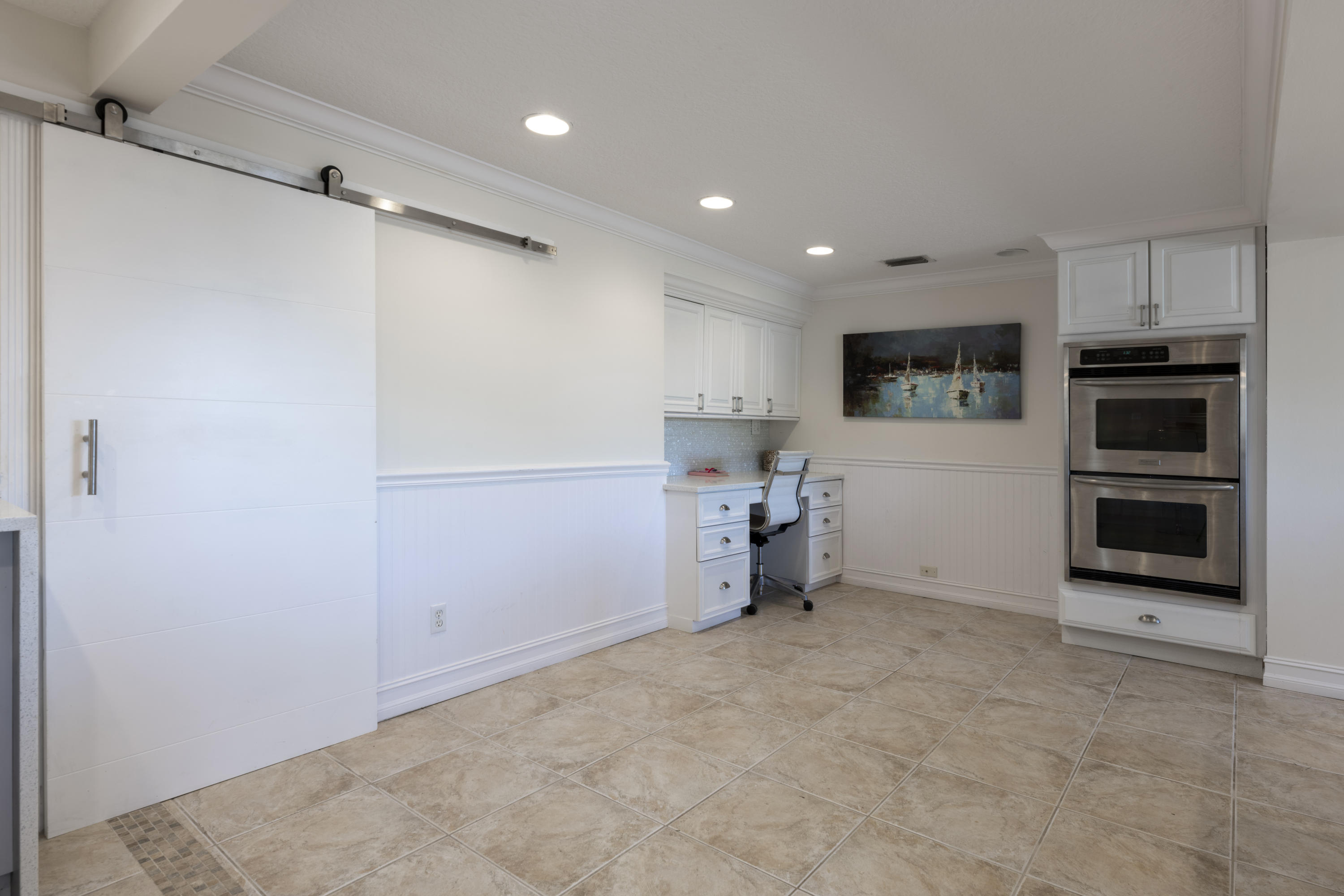 12920 Barrow Road North Palm Beach, FL 33408 - Photo 12 of 32 a view of a kitchen with a sink and dishwasher a refrigerator with a dishwasher