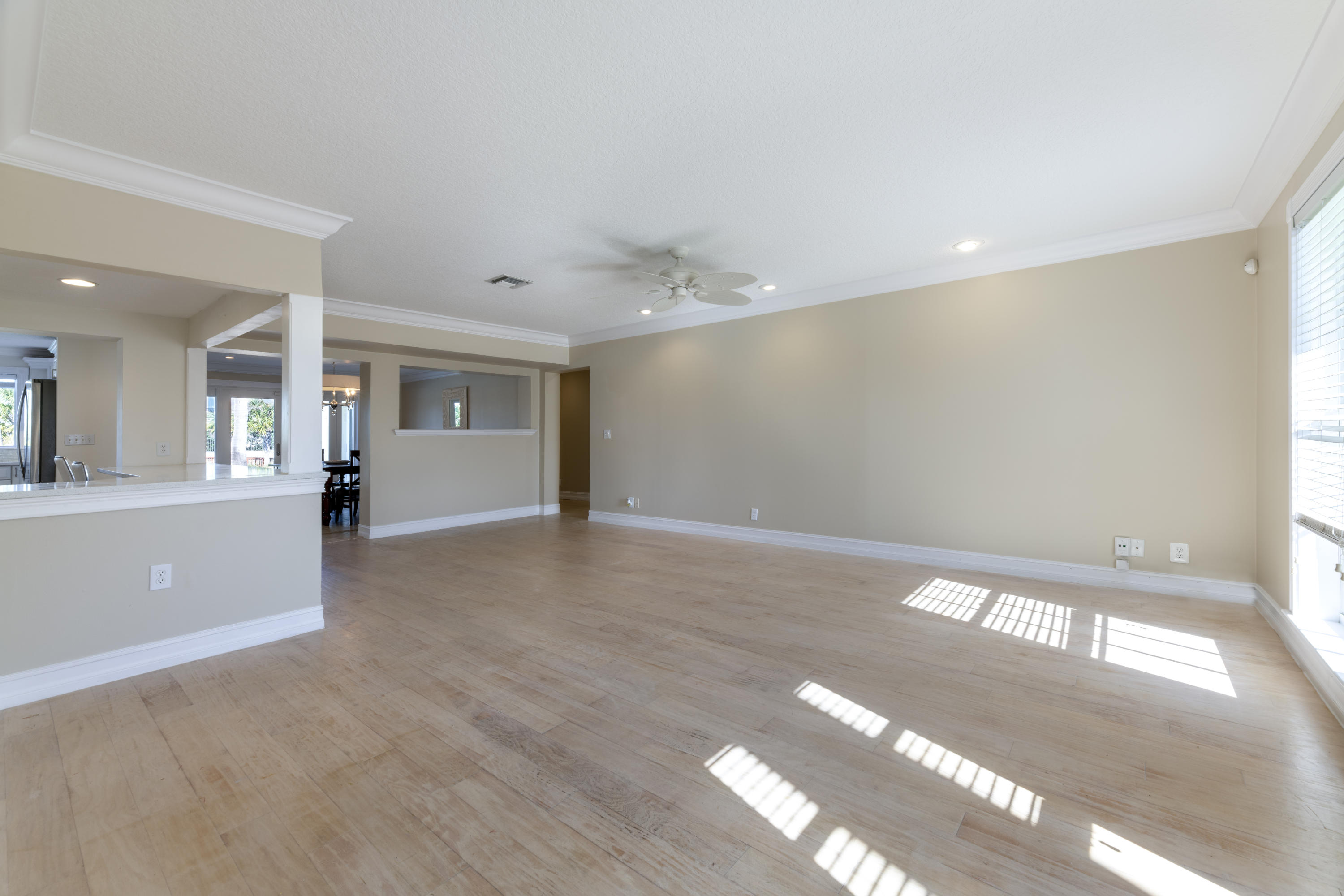 12920 Barrow Road North Palm Beach, FL 33408 - Photo 14 of 32 a view of an empty room with window and wooden floor
