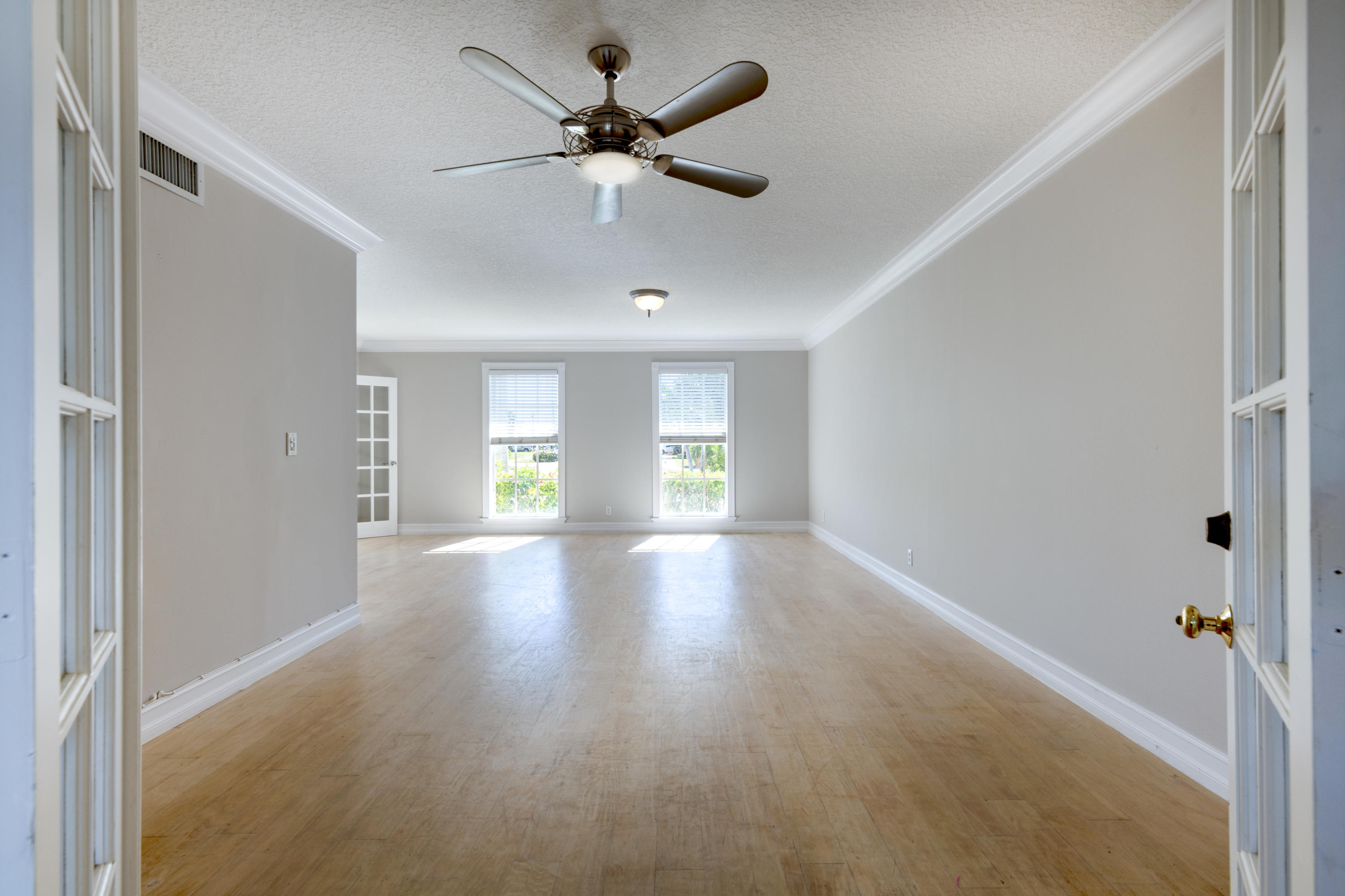 12920 Barrow Road North Palm Beach, FL 33408 - Photo 15 of 32 a view of a livingroom with a ceiling fan and window
