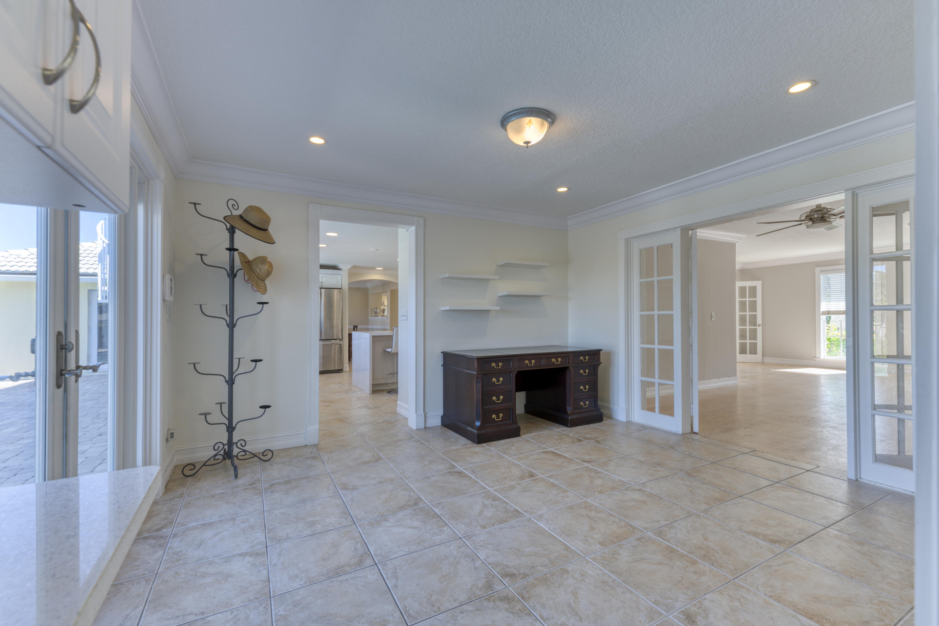 12920 Barrow Road North Palm Beach, FL 33408 - Photo 17 of 32 a view of an empty room with a fireplace