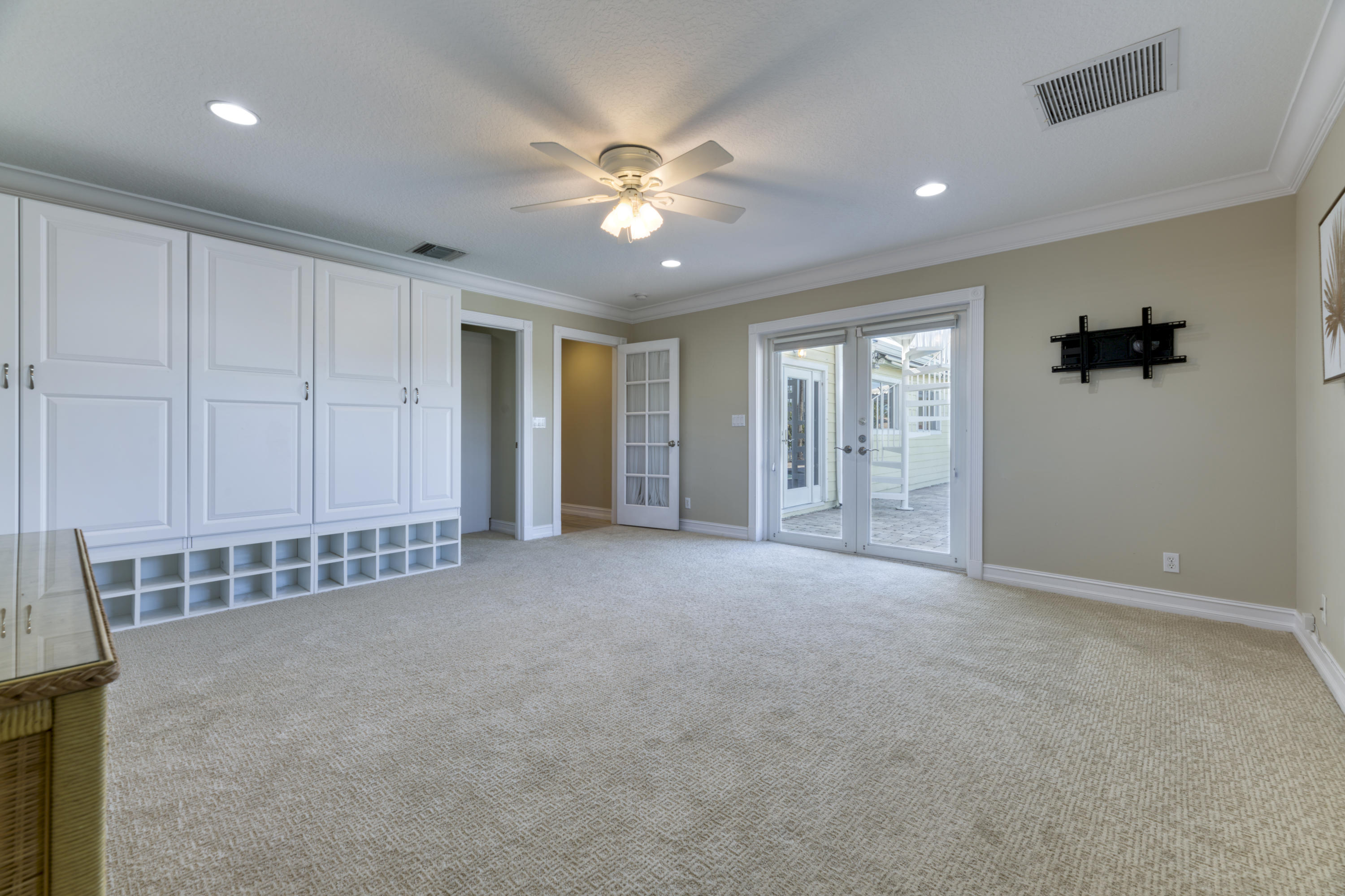 12920 Barrow Road North Palm Beach, FL 33408 - Photo 19 of 32 a view of an empty room with a ceiling fan
