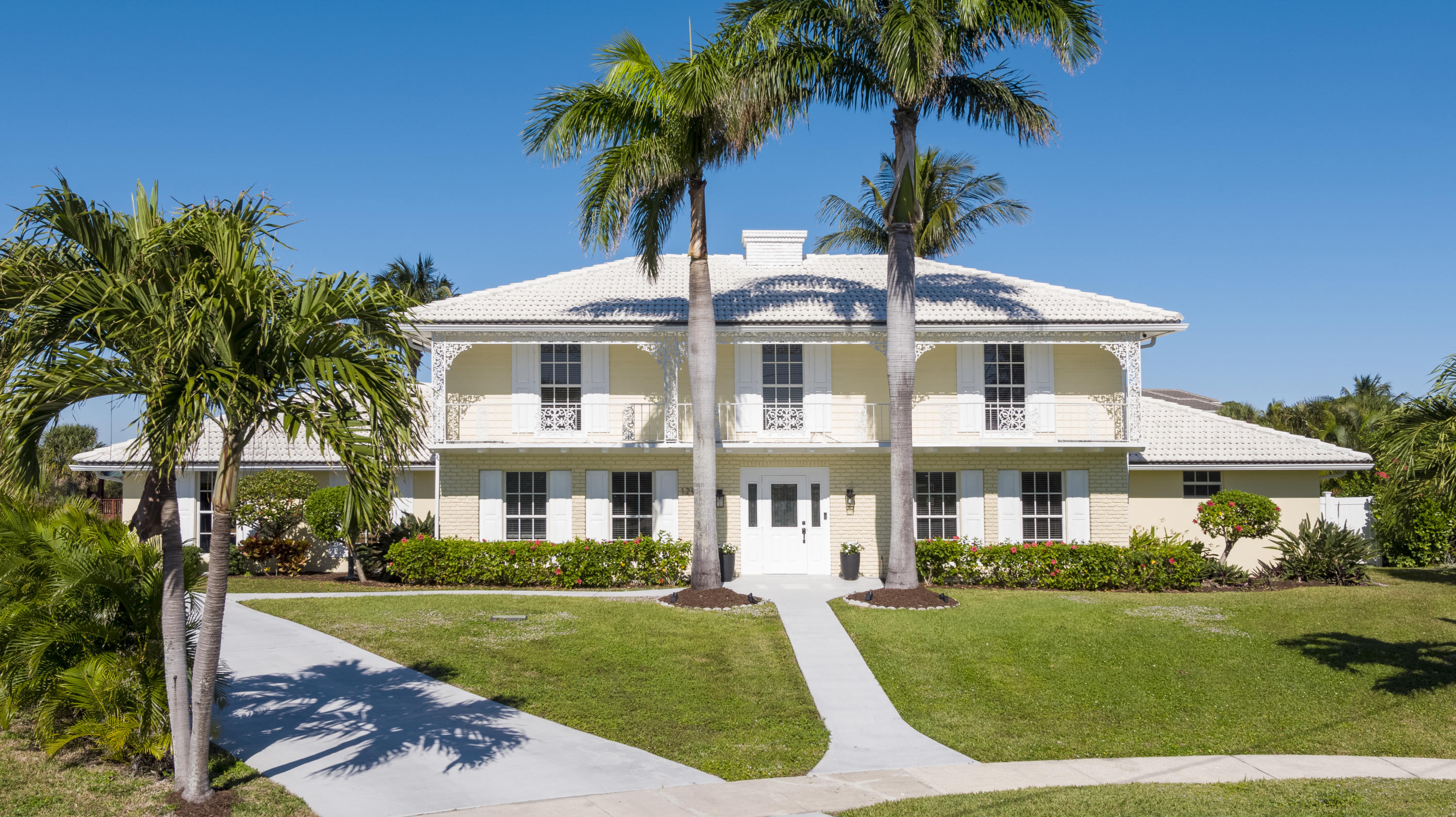 12920 Barrow Road North Palm Beach, FL 33408 - Photo 2 of 32 front view of a house with a yard