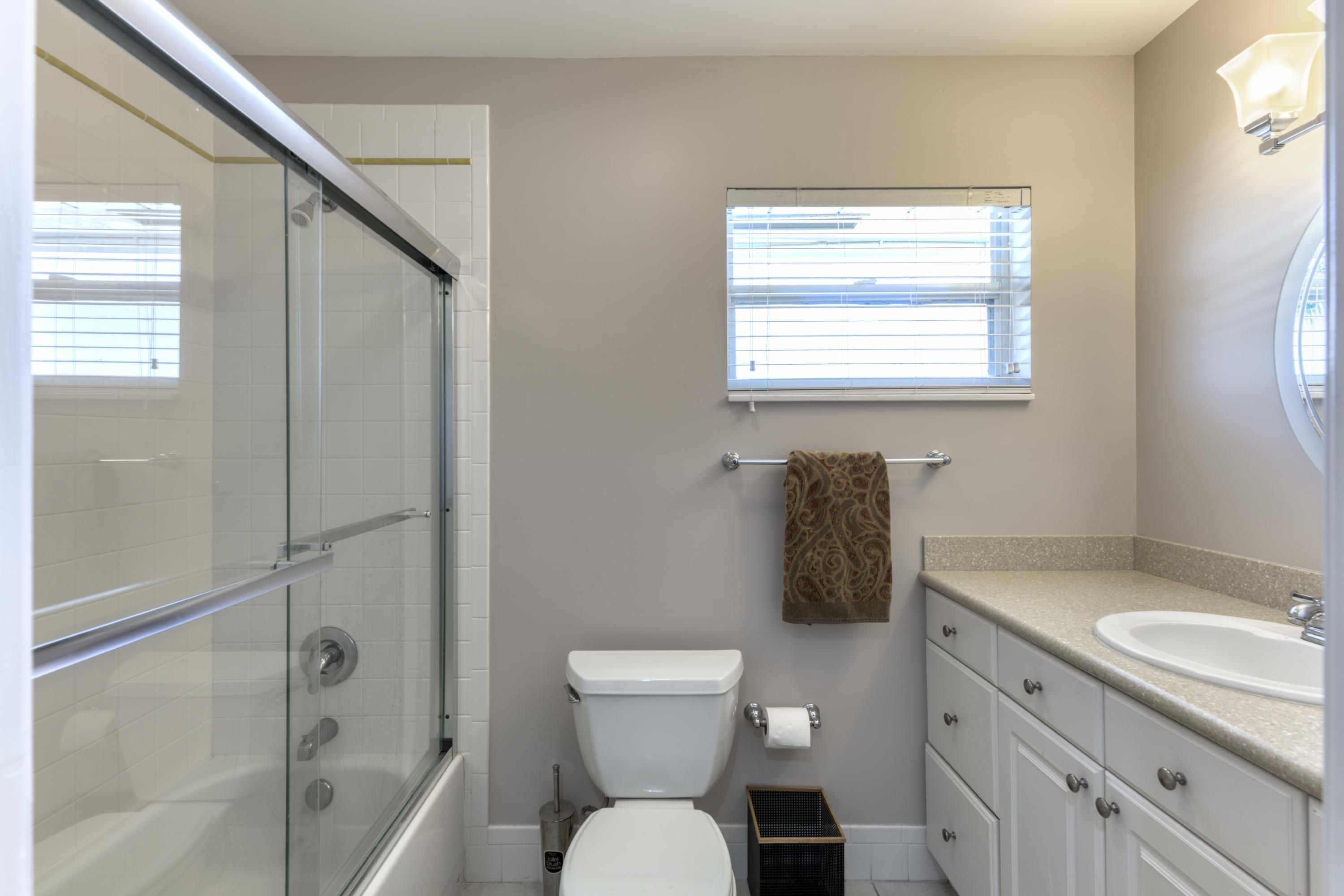 12920 Barrow Road North Palm Beach, FL 33408 - Photo 25 of 32 a bathroom with a granite countertop sink toilet and shower