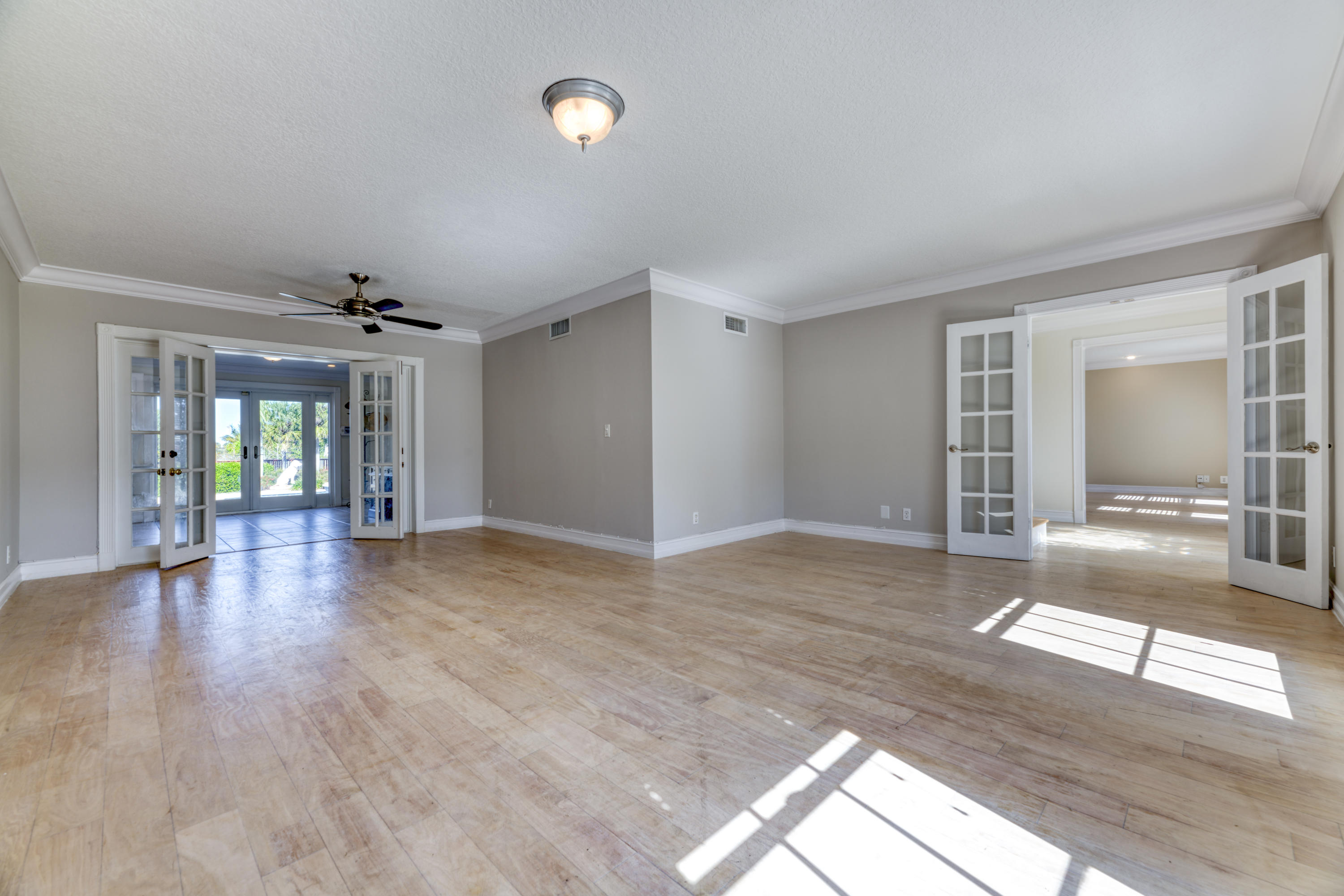 12920 Barrow Road North Palm Beach, FL 33408 - Photo 8 of 32 a view of livingroom with hardwood floor and window