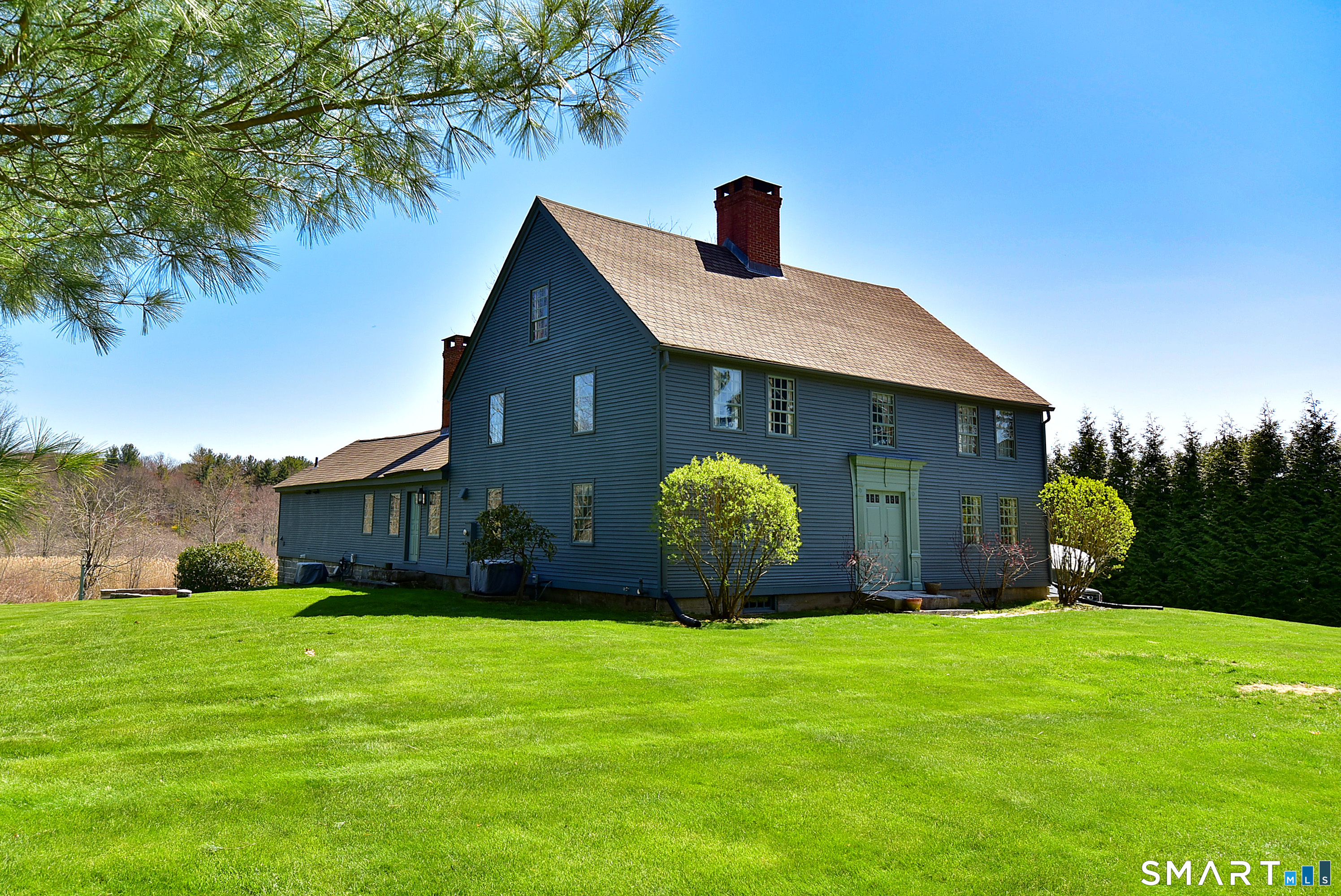 294 Jones Hollow Road Marlborough, CT 06447 - Photo 1 of 33 a front view of house with garden and porch