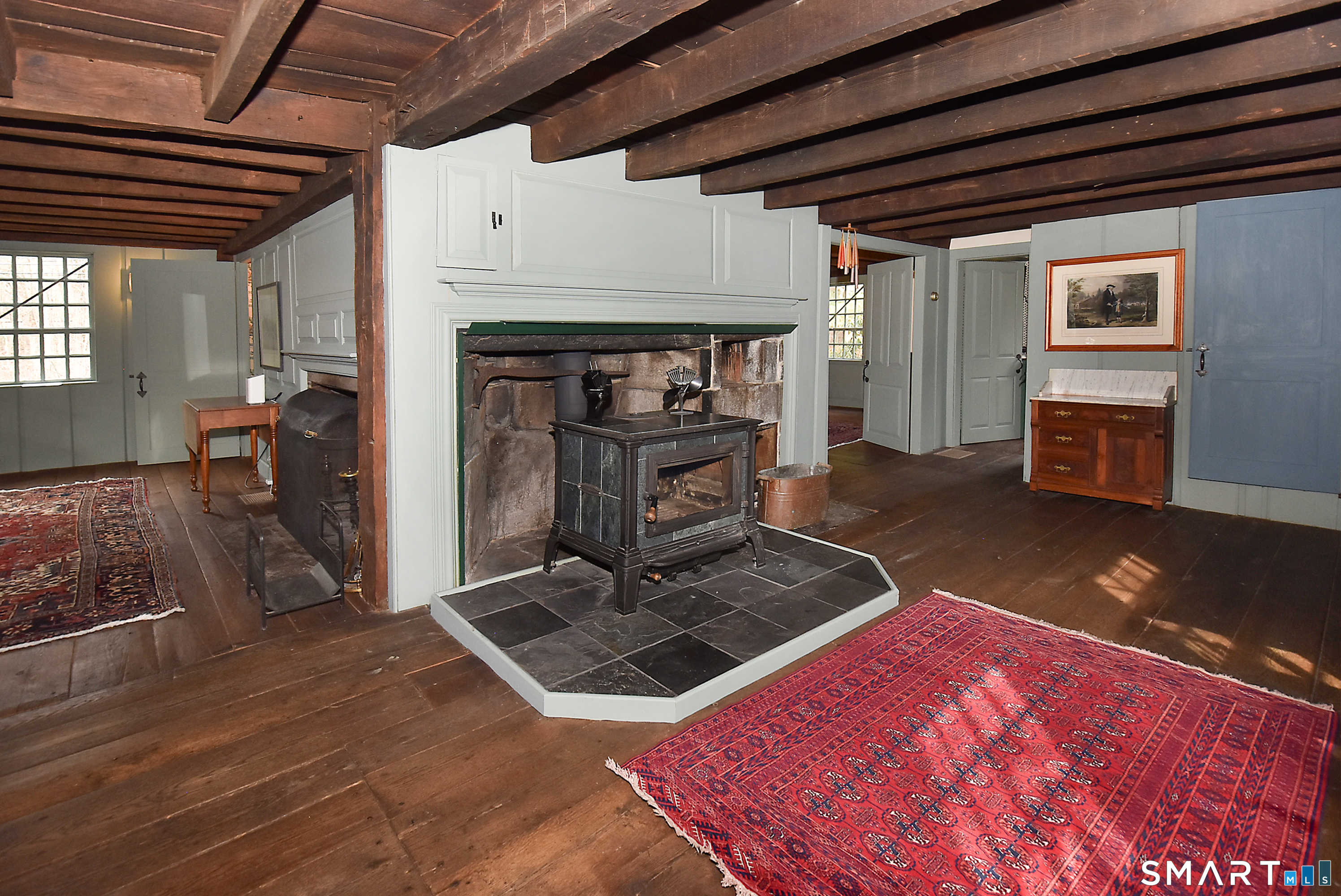 294 Jones Hollow Road Marlborough, CT 06447 - Photo 15 of 33 a living room with furniture flat screen tv and a fireplace