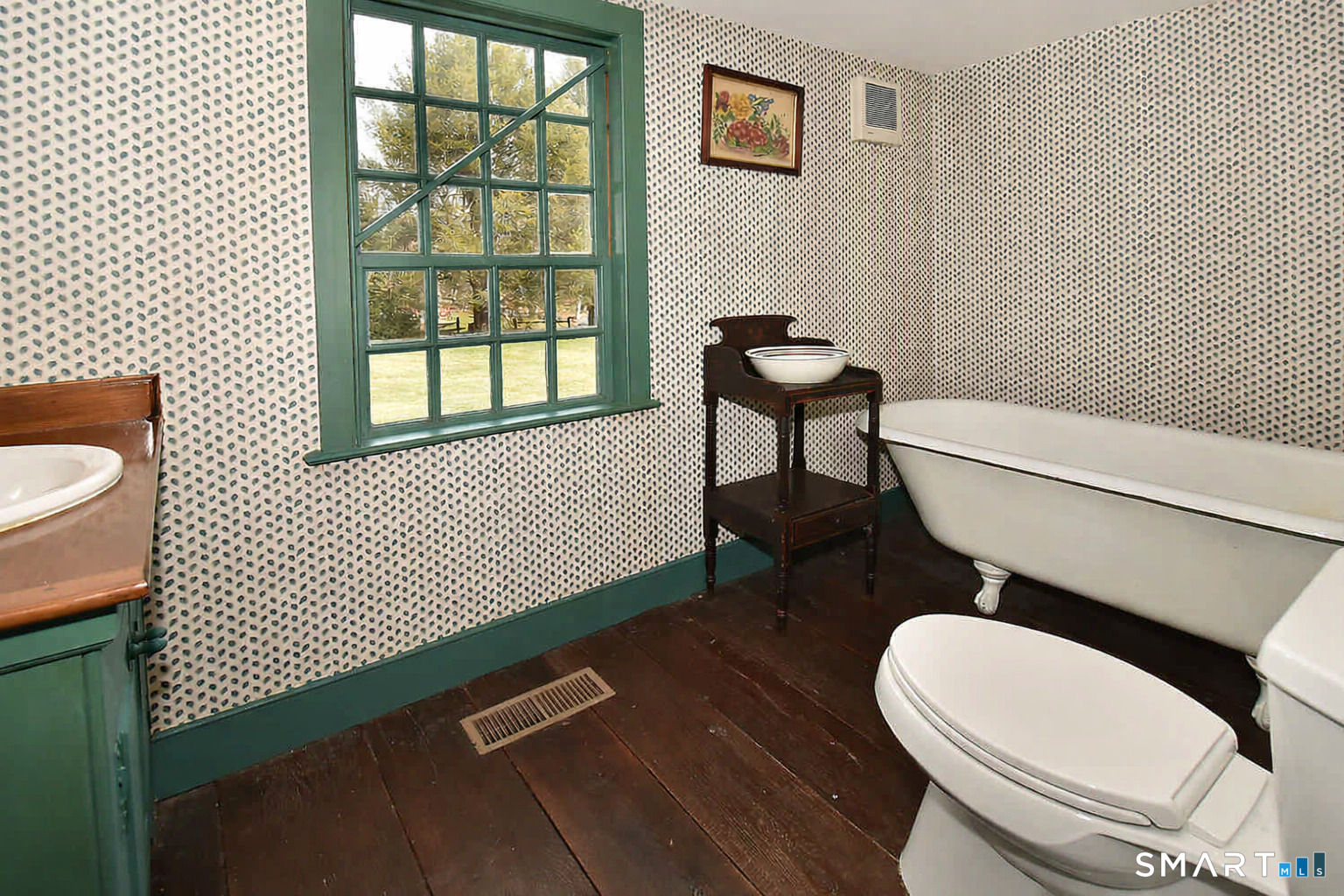 294 Jones Hollow Road Marlborough, CT 06447 - Photo 21 of 33 a white toilet sitting next to a bathroom sink