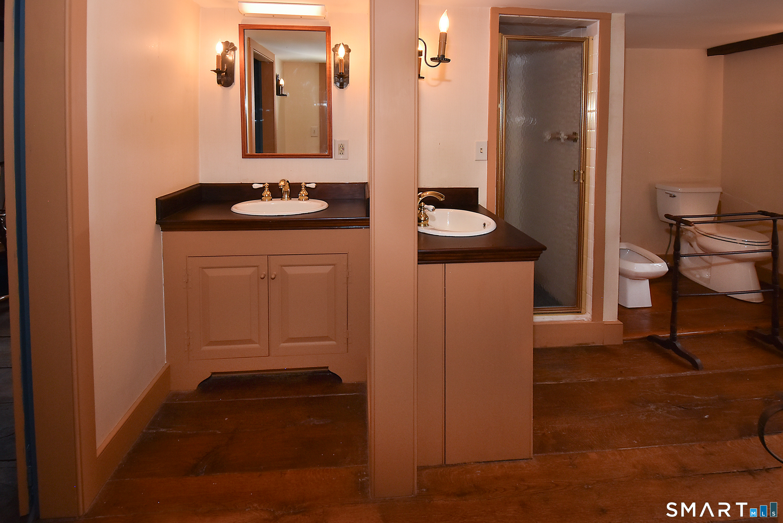 294 Jones Hollow Road Marlborough, CT 06447 - Photo 26 of 33 a bathroom with a sink and a mirror