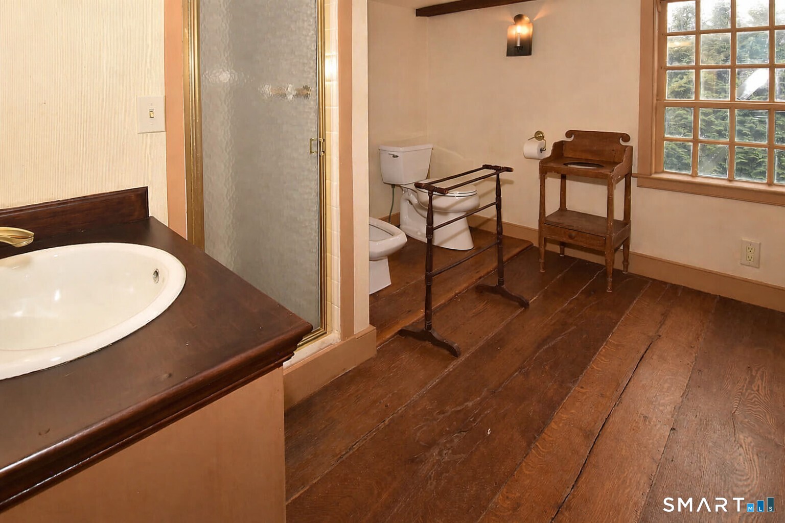 294 Jones Hollow Road Marlborough, CT 06447 - Photo 27 of 33 a view of a room that has a bench and a table in it