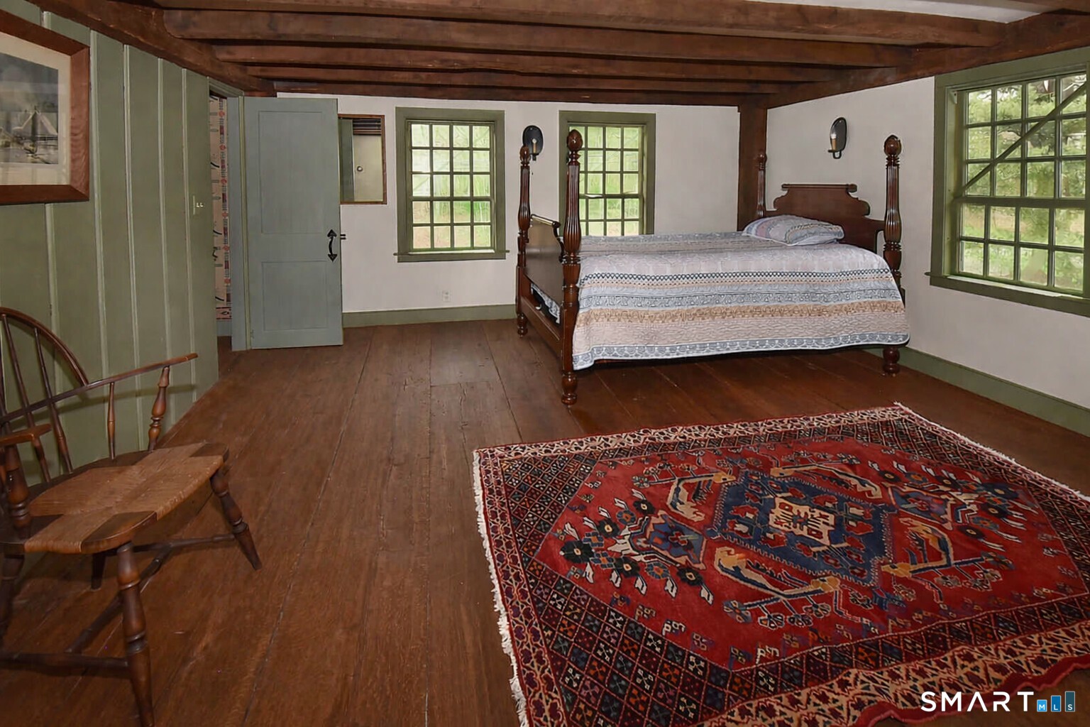 294 Jones Hollow Road Marlborough, CT 06447 - Photo 30 of 33 a bed sitting in a bedroom next to a window