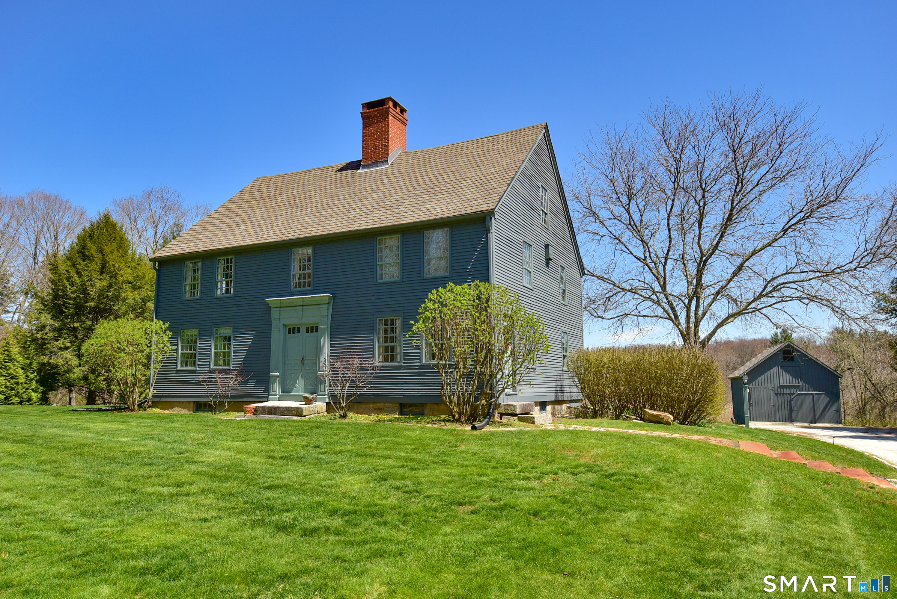 294 Jones Hollow Road Marlborough, CT 06447 - Photo 3 of 33 a front view of a house with garden
