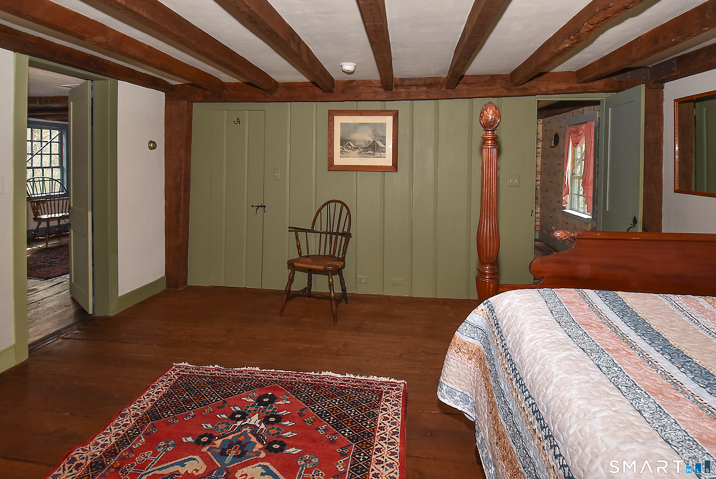 294 Jones Hollow Road Marlborough, CT 06447 - Photo 31 of 33 a bed sitting in a bedroom next to a window