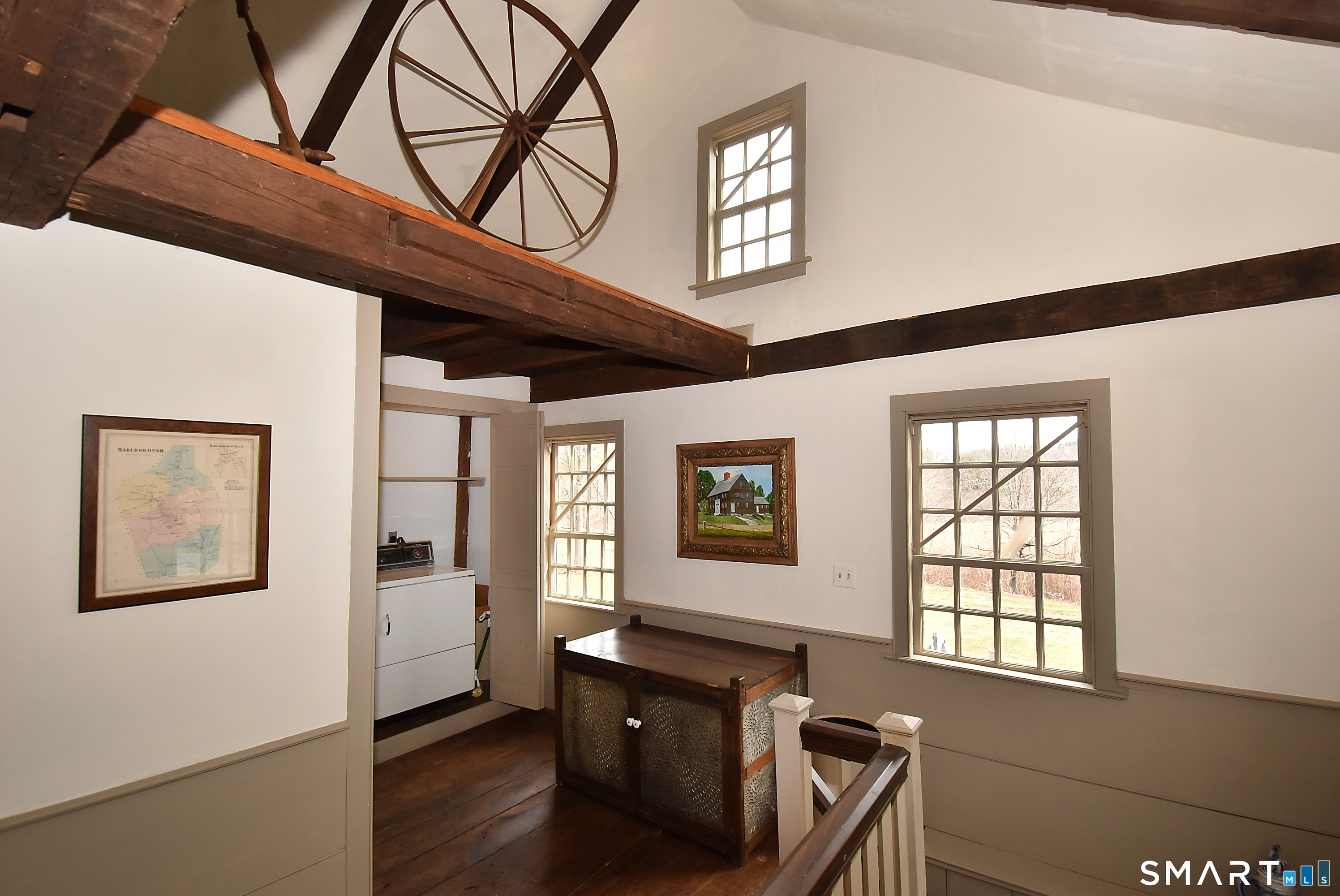 294 Jones Hollow Road Marlborough, CT 06447 - Photo 9 of 33 a view of a hallway with a window and wooden floor