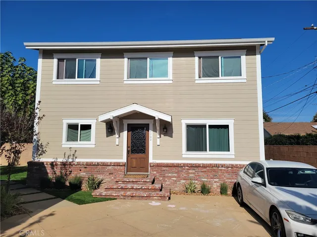 a front view of a house with parking space