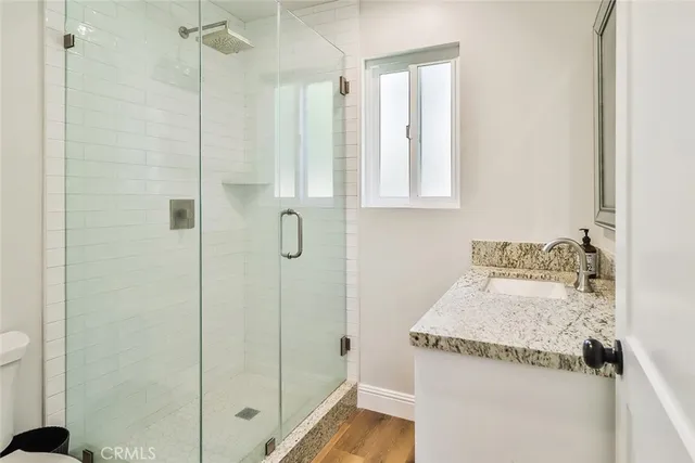 an empty room with wooden floor