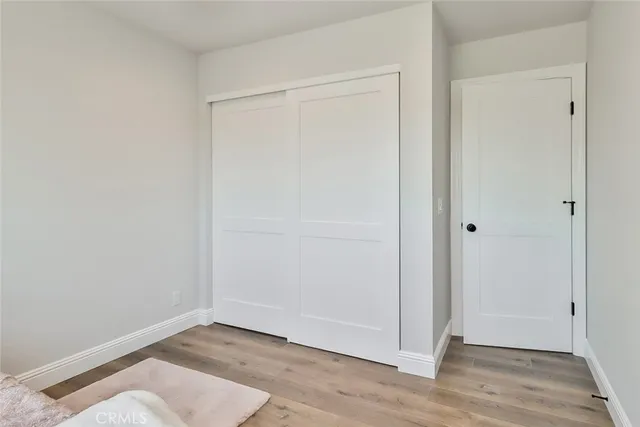 a view of room with wooden floor and window