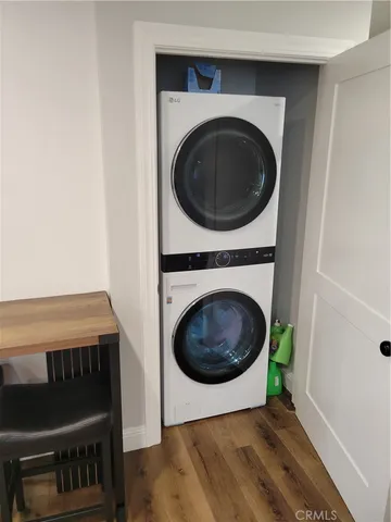 a view of a bedroom with washer and dryer