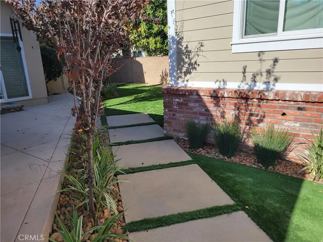 a view of a back yard of the house