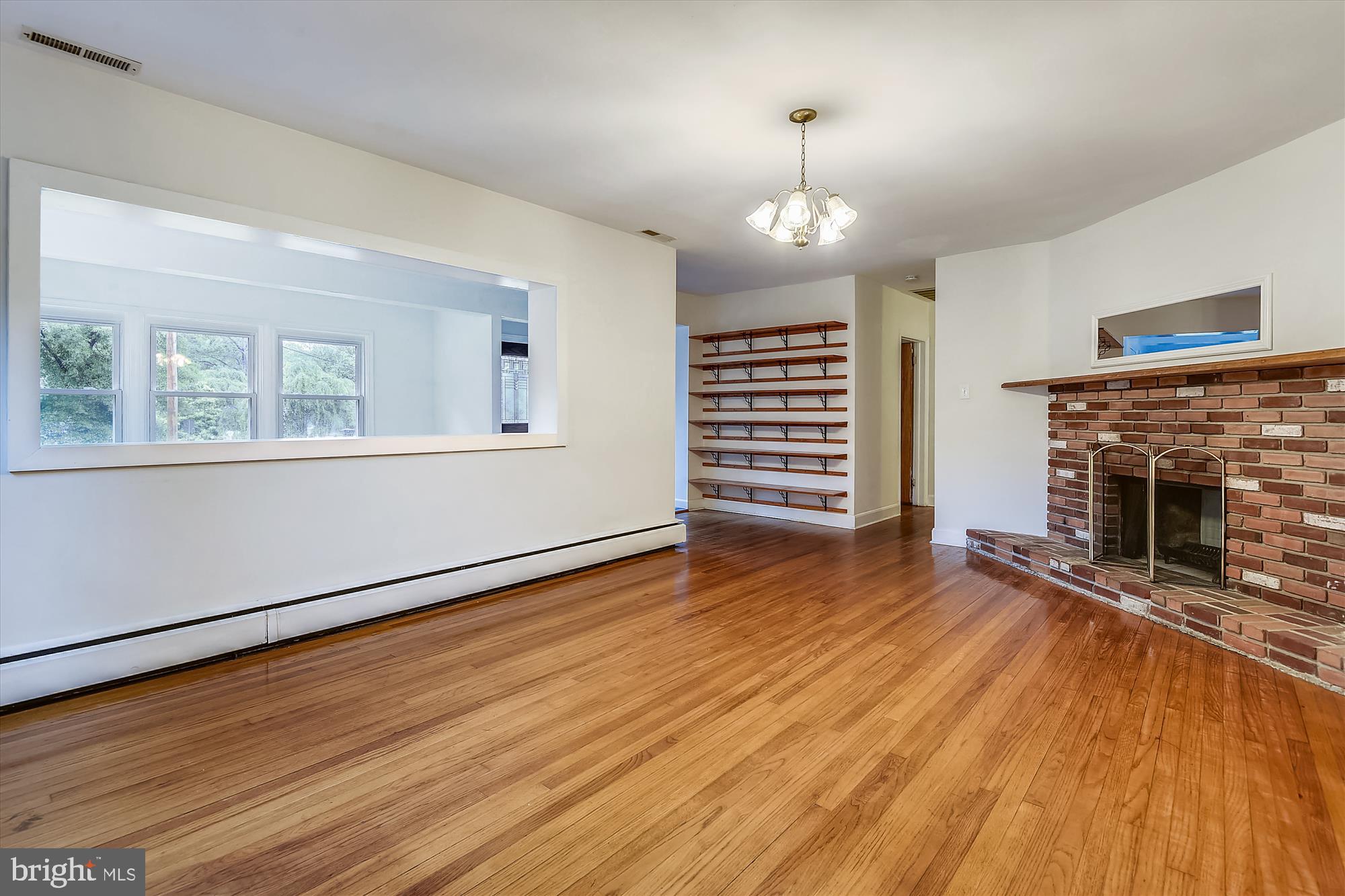 1137 Hampton Road Annapolis, MD 21409 - Photo 10 of 61 View of Living Rm to Foyer Shelving & Sunroom