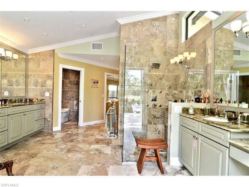 12902 Coco Plum Lane Naples, FL 34119 - Photo 11 of 23 a room with a sink and a view of living room