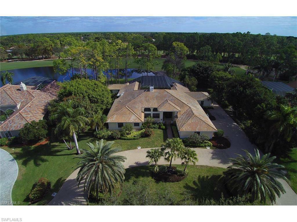 12902 Coco Plum Lane Naples, FL 34119 - Photo 13 of 23 a aerial view of a house with a yard