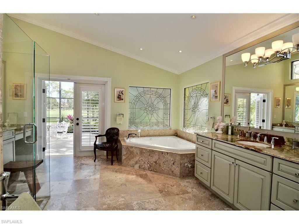 12902 Coco Plum Lane Naples, FL 34119 - Photo 19 of 23 a living room with furniture and a large window