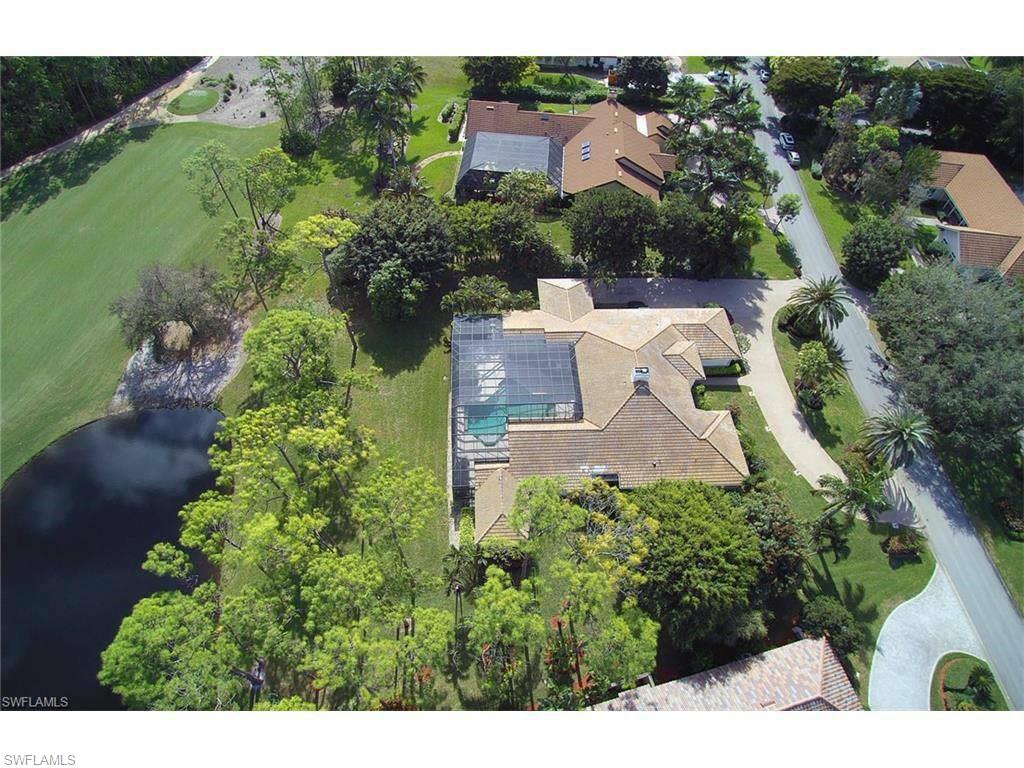 12902 Coco Plum Lane Naples, FL 34119 - Photo 2 of 23 an aerial view of a house with outdoor space and street view