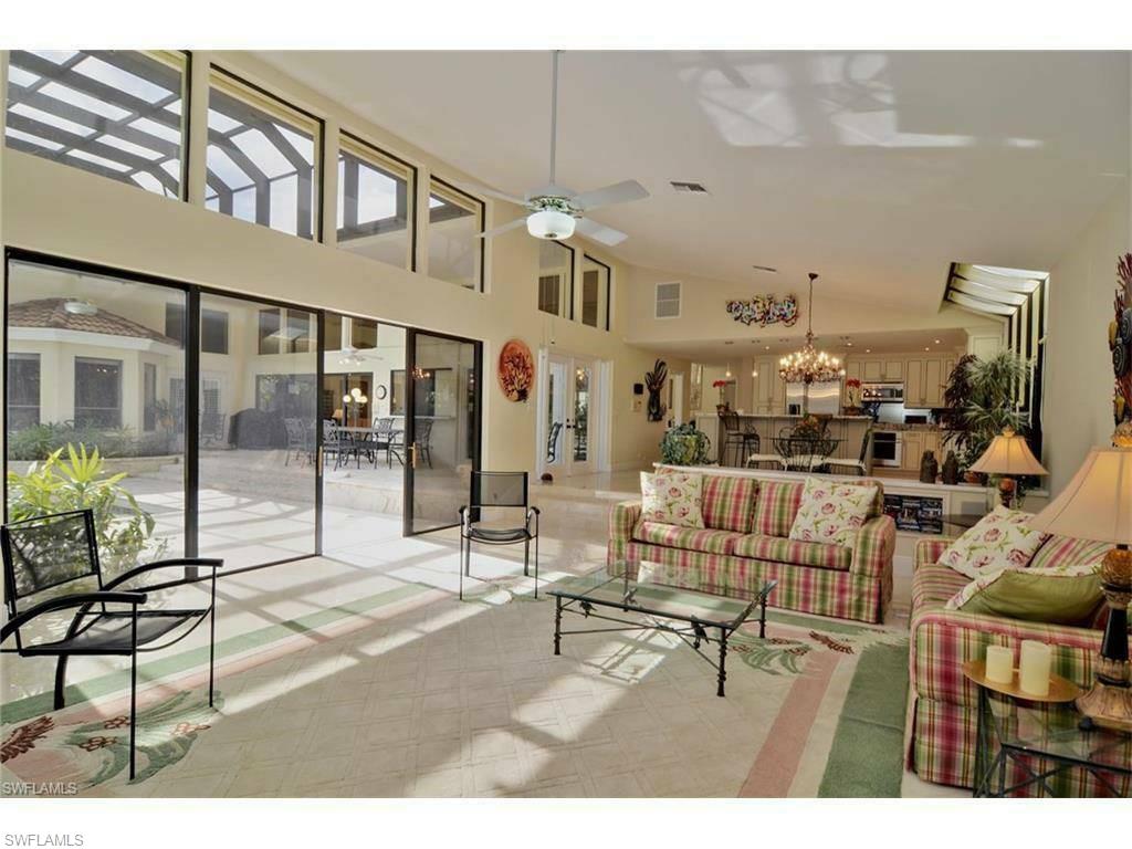 12902 Coco Plum Lane Naples, FL 34119 - Photo 8 of 23 a living room with furniture