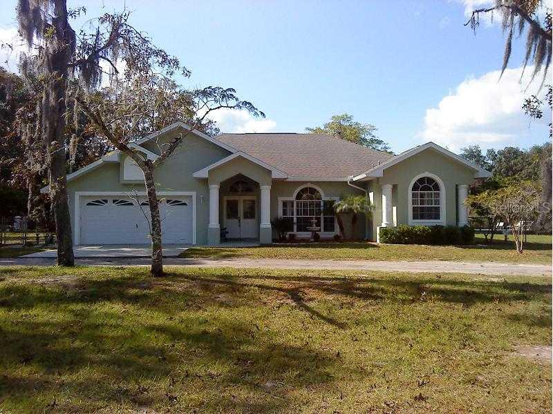 12821 Spur Road Hudson, FL 34669 - Photo 1 of 1 Exterior Front - Custom built by Nugent Homes in 1995. Almost 2 acres!