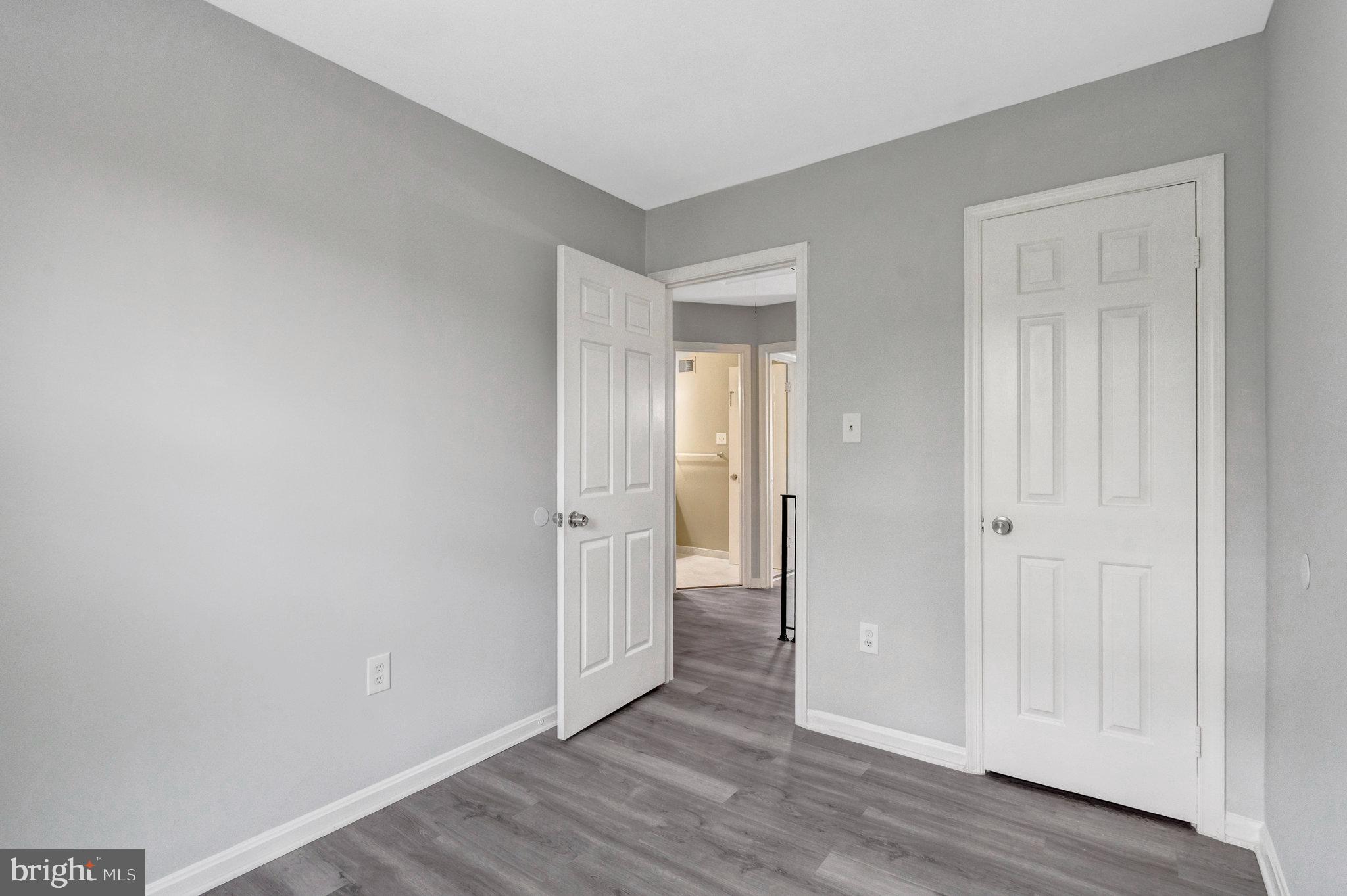 7905 Brighton Way Manassas, VA 20109 - Photo 20 of 32 a view of an empty room and wooden floor