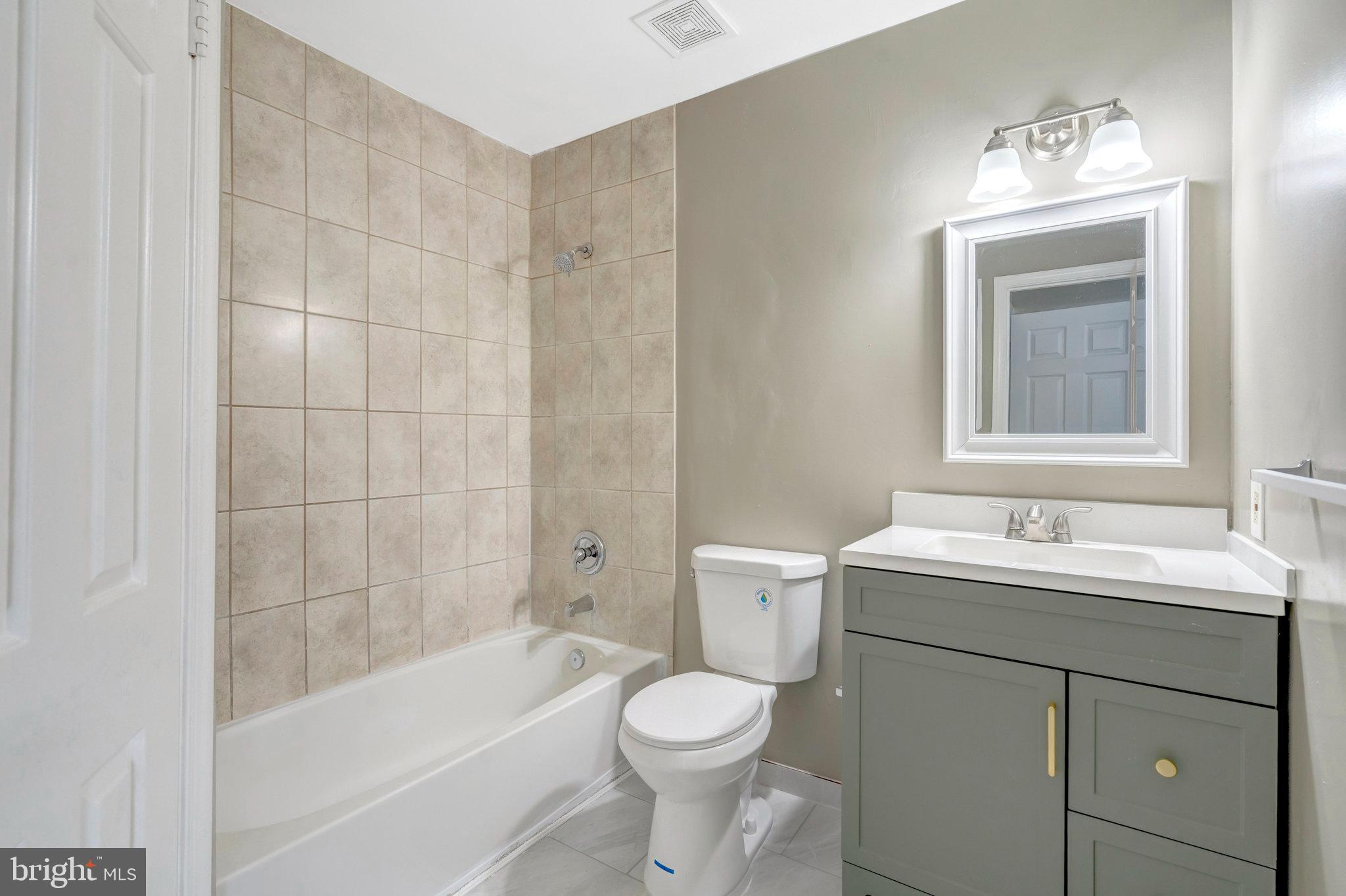 7905 Brighton Way Manassas, VA 20109 - Photo 23 of 32 a bathroom with a sink toilet and shower