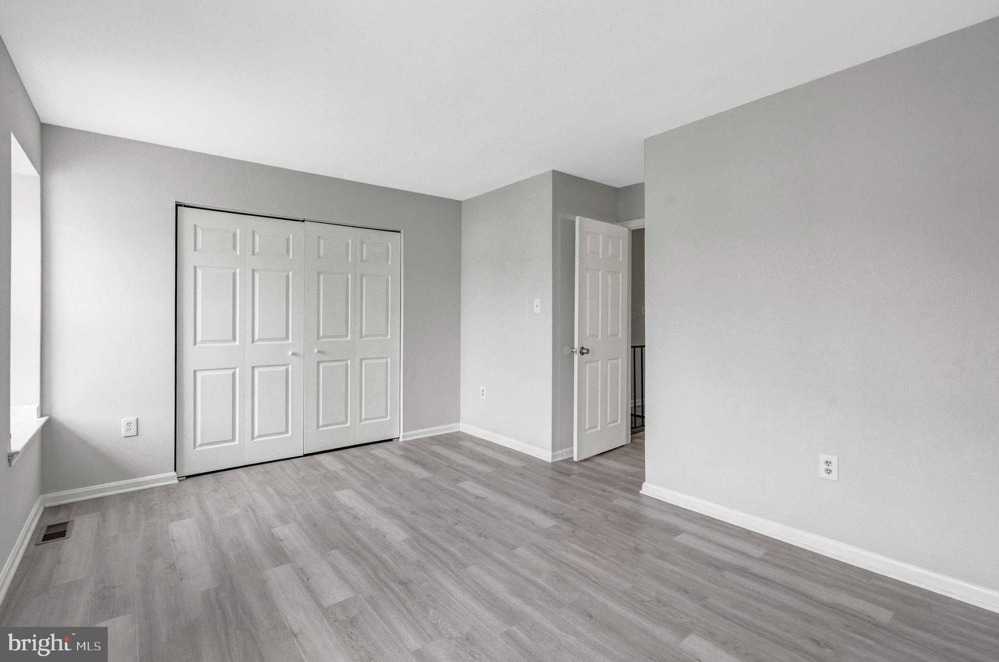 7905 Brighton Way Manassas, VA 20109 - Photo 25 of 32 a view of an empty room with wooden floor