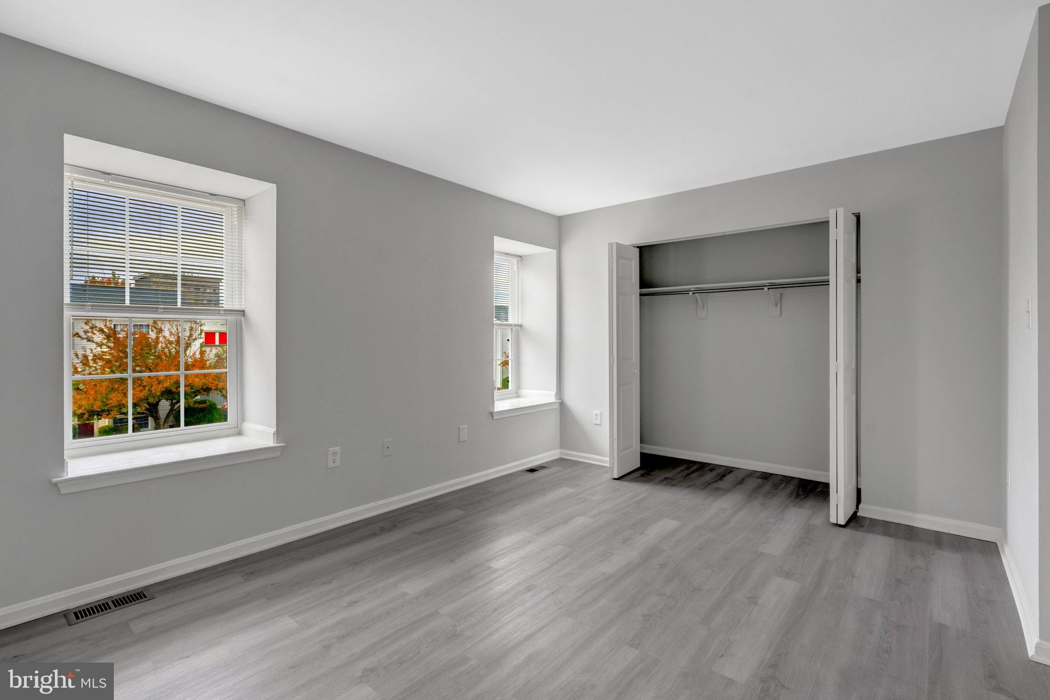 7905 Brighton Way Manassas, VA 20109 - Photo 27 of 32 a view of an empty room with wooden floor and a window
