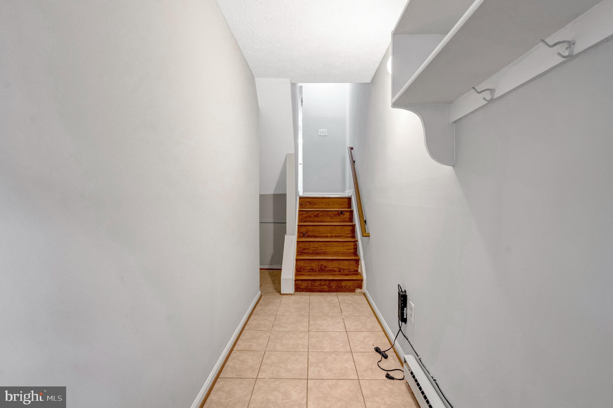 7905 Brighton Way Manassas, VA 20109 - Photo 7 of 32 a view of hallway with stairs