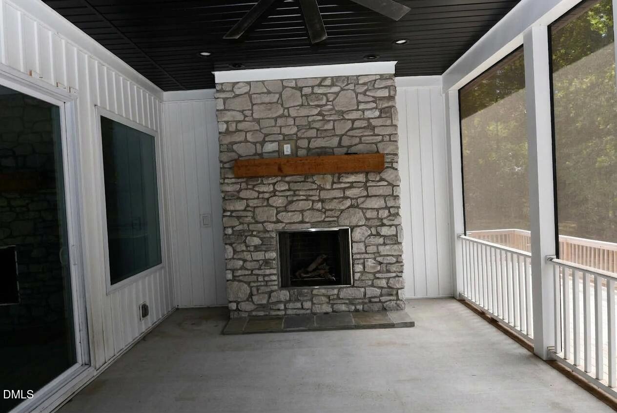 794 Cobb Road Coats, NC 27521 - Photo 22 of 32 Screen Porch with fireplace