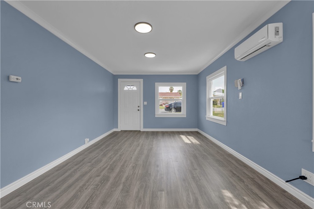 34945 Ave B Yucaipa, CA 92399 - Photo 11 of 69 wooden floor in an empty room with a window