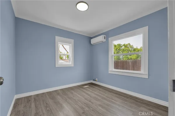 a bathroom with a granite countertop sink a mirror and vanity