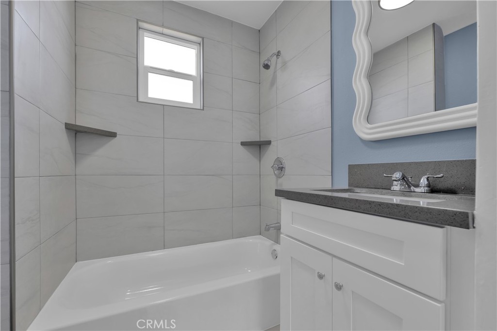 34945 Ave B Yucaipa, CA 92399 - Photo 24 of 69 a bathroom with a bathtub sink and cabinets