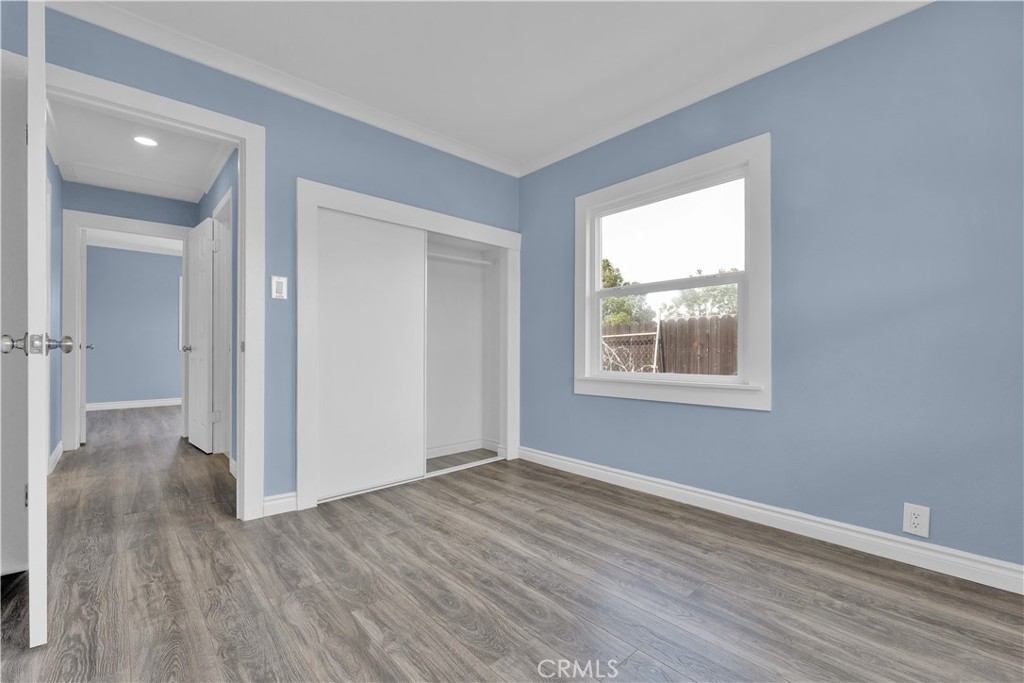 34945 Ave B Yucaipa, CA 92399 - Photo 28 of 69 a view of an empty room with wooden floor and a window