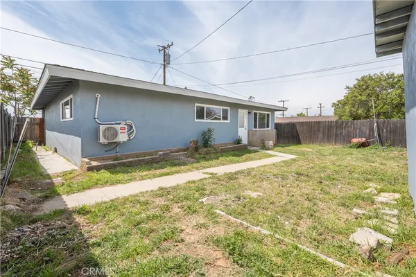 a view of kitchen with granite countertop cabinets and wooden floor