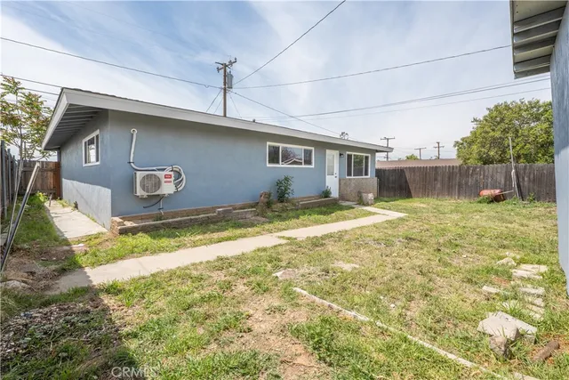 a view of kitchen with granite countertop cabinets and wooden floor