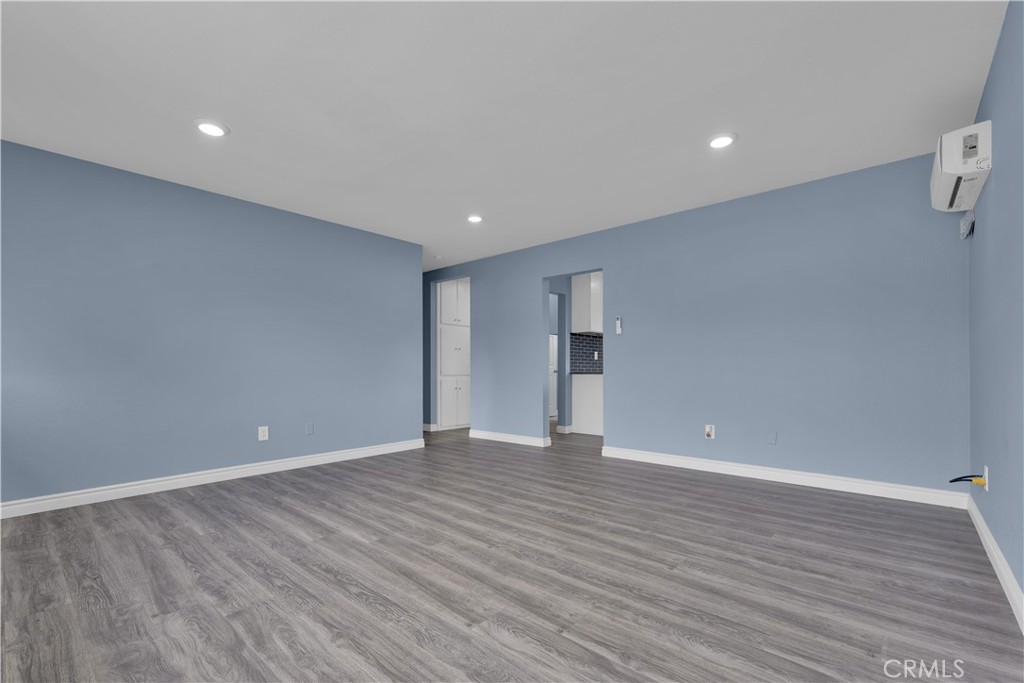 34945 Ave B Yucaipa, CA 92399 - Photo 32 of 69 a view of an empty room with wooden floor