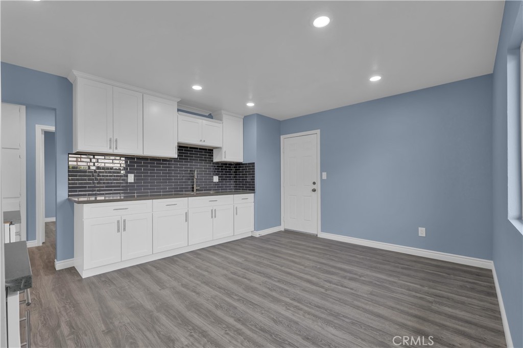 34945 Ave B Yucaipa, CA 92399 - Photo 37 of 69 a view of kitchen with granite countertop cabinets and wooden floor
