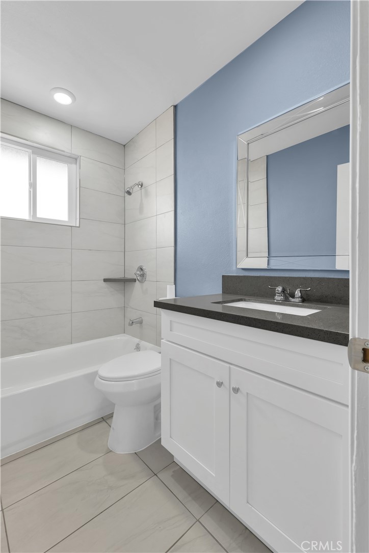 34945 Ave B Yucaipa, CA 92399 - Photo 44 of 69 a bathroom with a sink a toilet and a bathtub