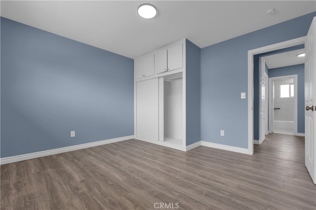 34945 Ave B Yucaipa, CA 92399 - Photo 50 of 69 a view of an empty room with wooden floor and closet