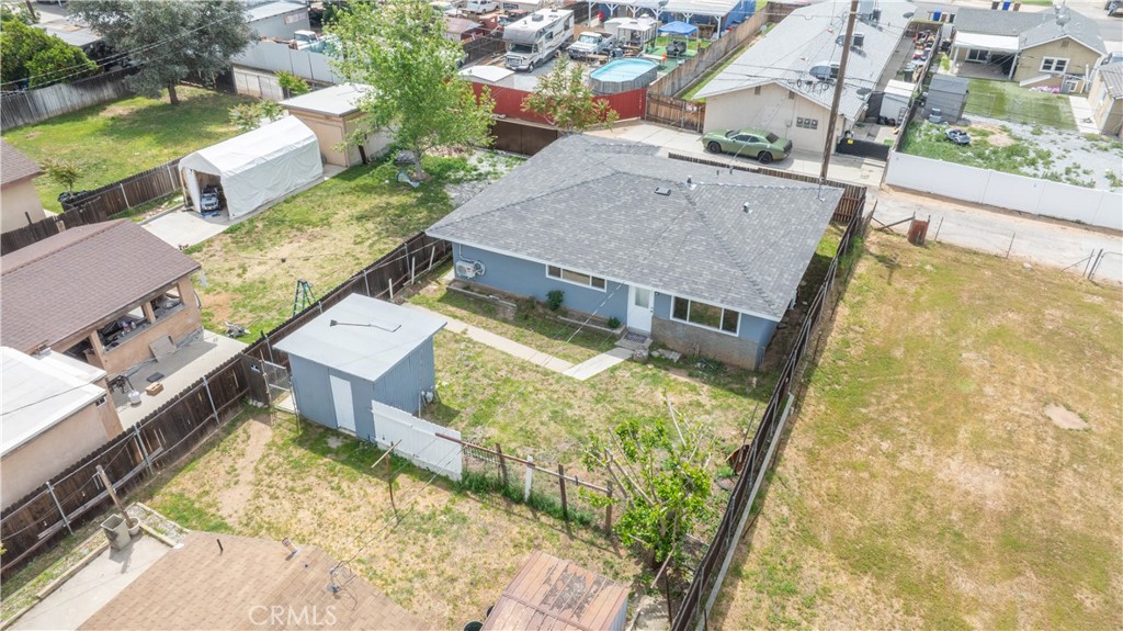 34945 Ave B Yucaipa, CA 92399 - Photo 59 of 69 an aerial view of a house with swimming pool and large trees