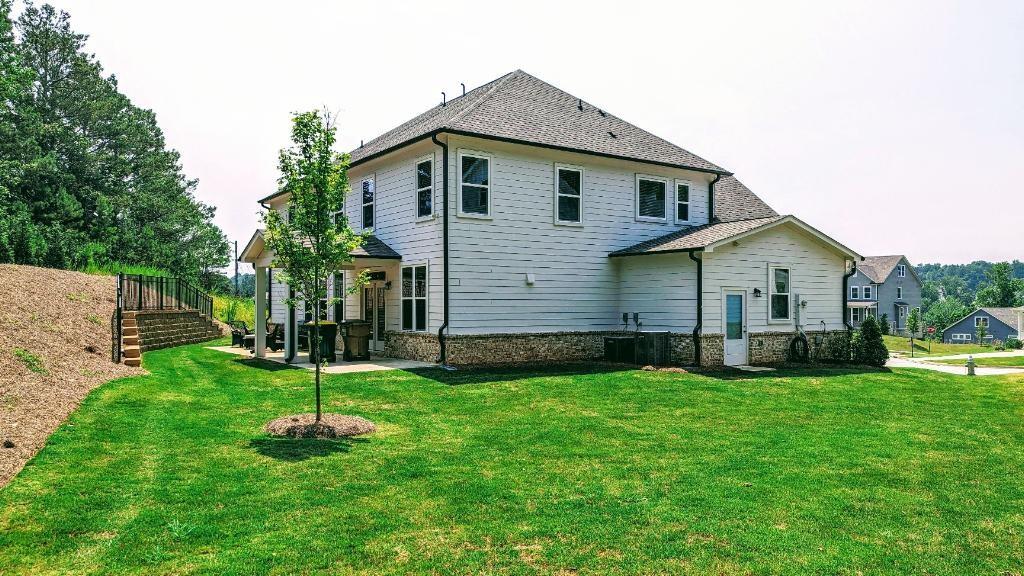 4830 Spangle Court Cumming, GA 30028 - Photo 2 of 18 a front view of house with a garden