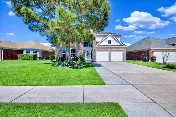 a house with garden in front of it